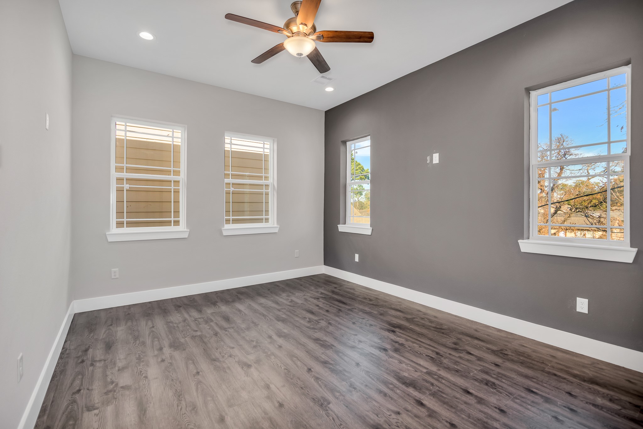 4924 Winnetka Street, Unit A Houston, TX 77021 - Photo 15 of 26 a view of an empty room with a window and wooden floor