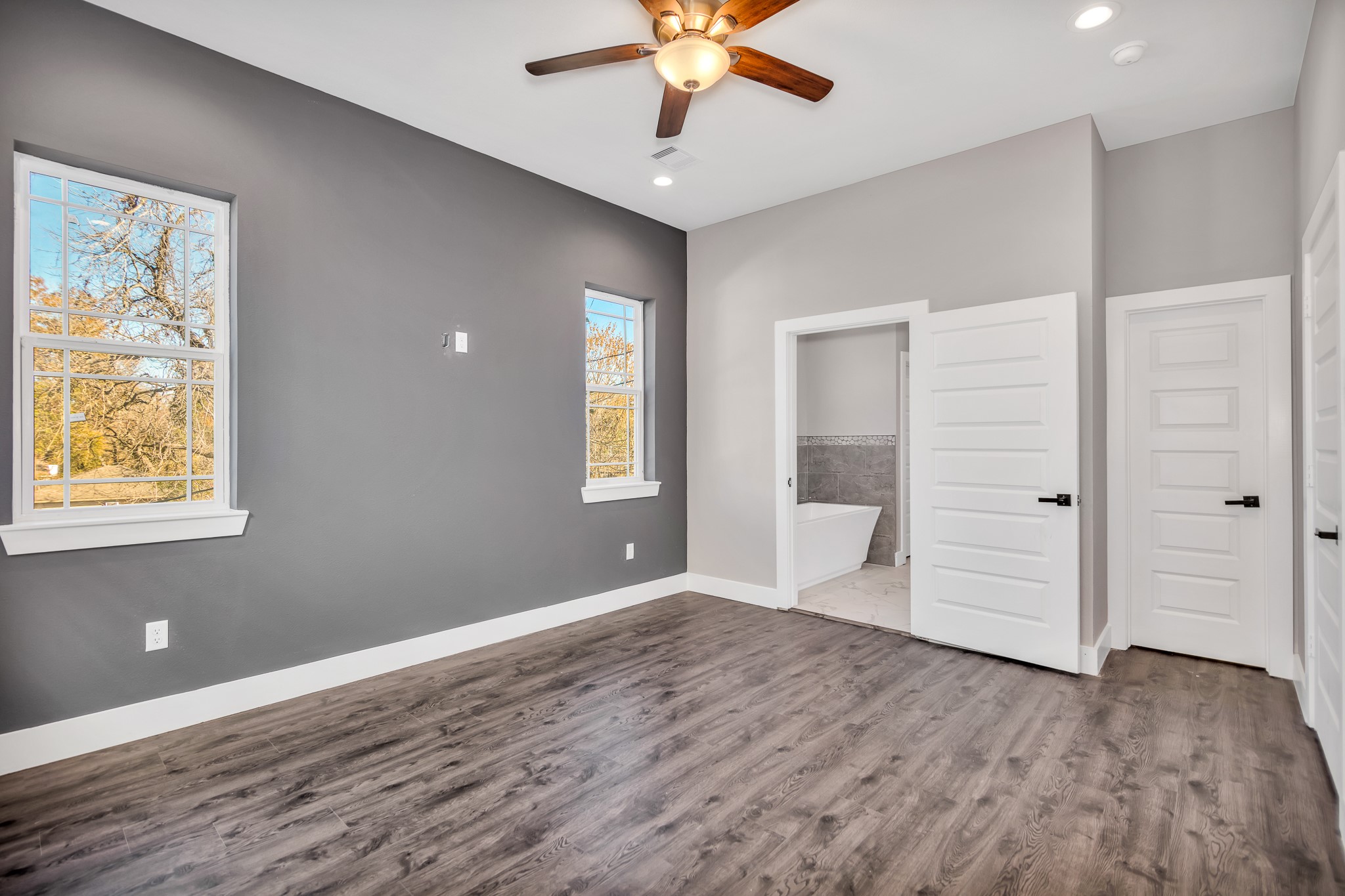 4924 Winnetka Street, Unit A Houston, TX 77021 - Photo 16 of 26 a view of an empty room with window and wooden floor
