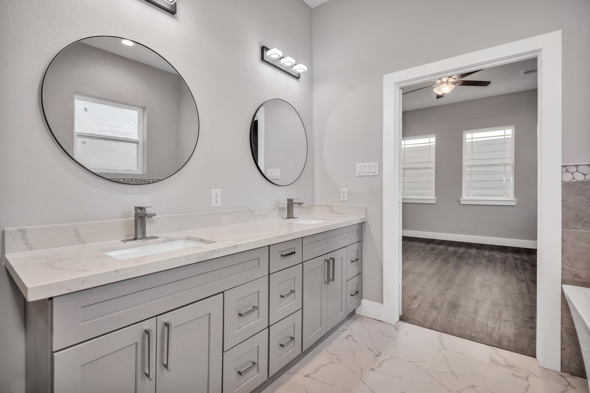 4924 Winnetka Street, Unit A Houston, TX 77021 - Photo 20 of 26 a bathroom with a double vanity sink and a mirror
