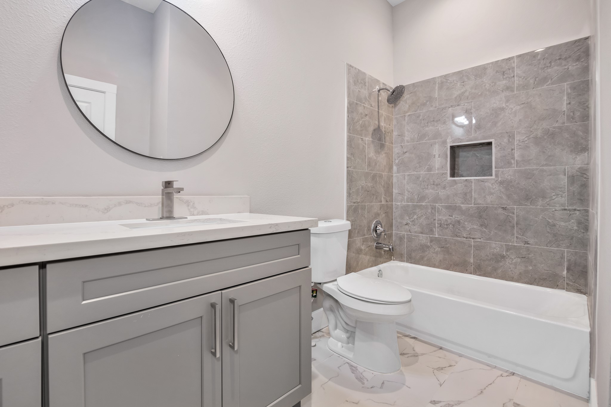 4924 Winnetka Street, Unit A Houston, TX 77021 - Photo 23 of 26 a bathroom with a sink a toilet and a mirror