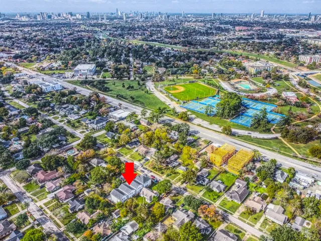 an aerial view of residential houses with outdoor space