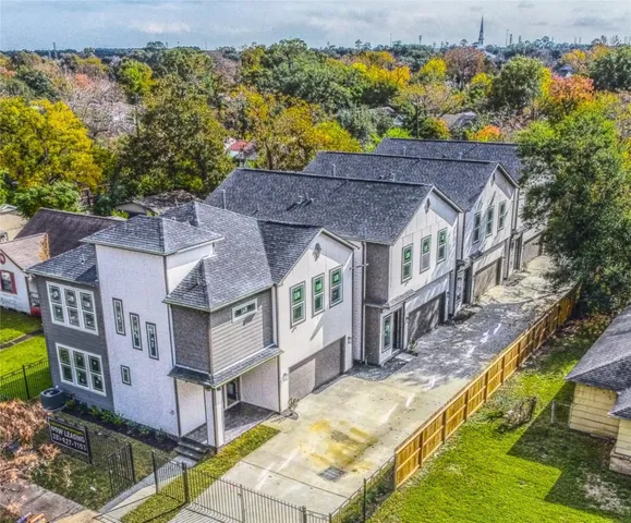 an aerial view of a house with a swimming pool