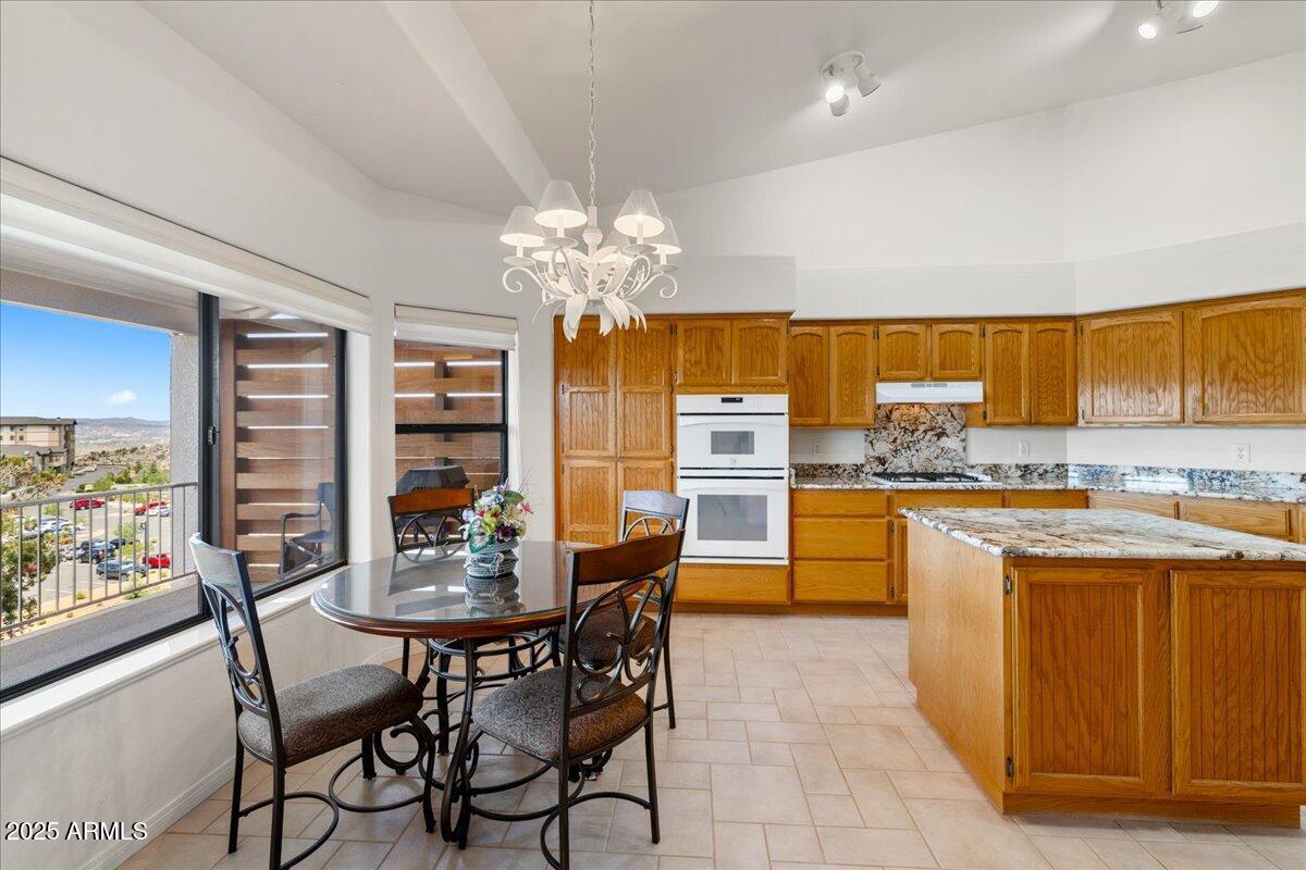 528 Miracle Rider Road Prescott, AZ 86301 - Photo 13 of 47 a view of a dining room with furniture and chandelier