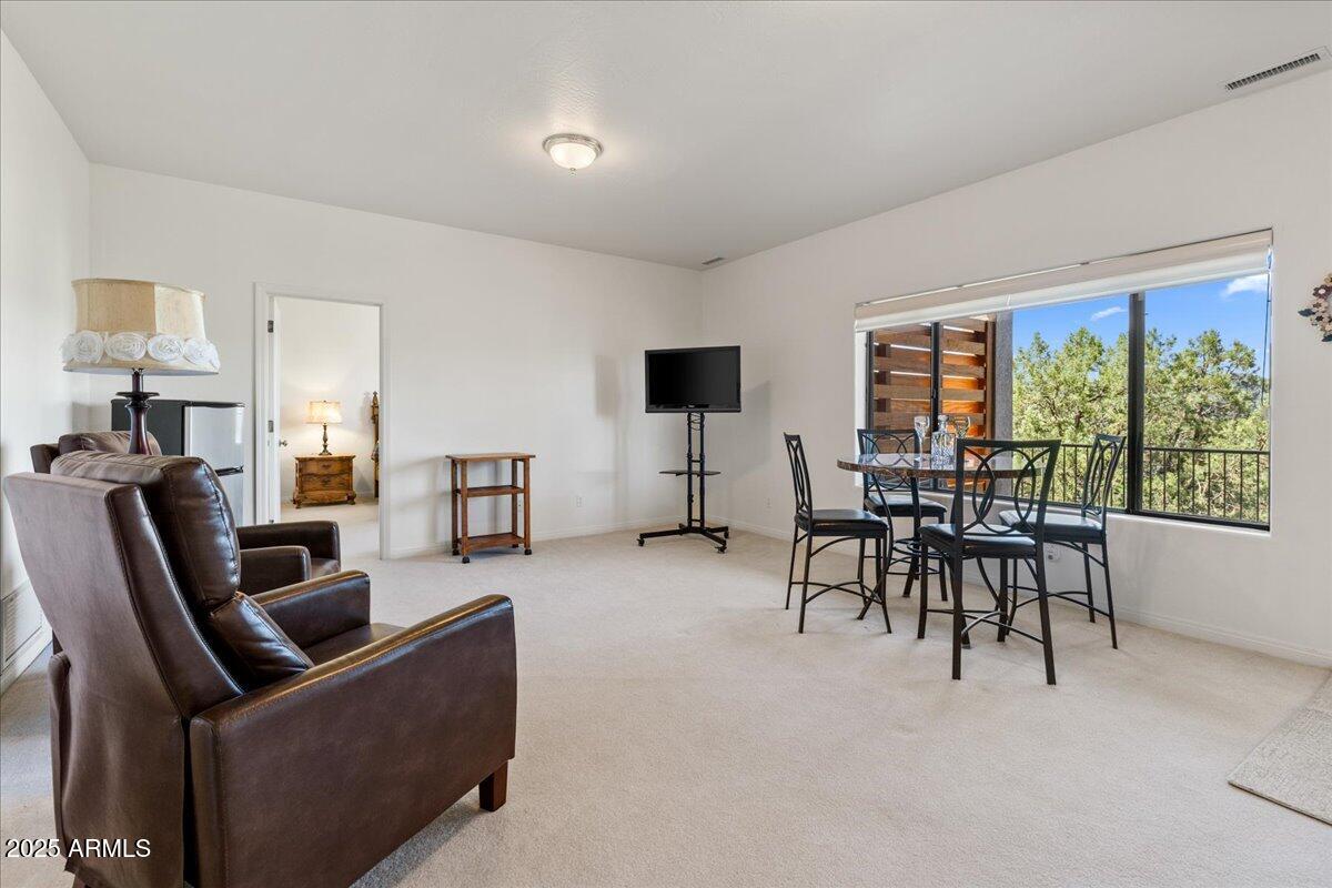 528 Miracle Rider Road Prescott, AZ 86301 - Photo 25 of 47 a living room with furniture and a flat screen tv