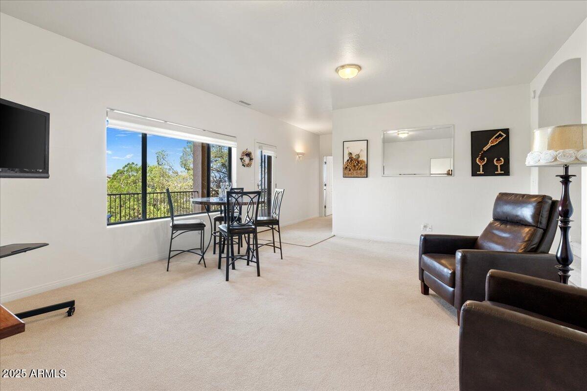 528 Miracle Rider Road Prescott, AZ 86301 - Photo 26 of 47 a living room with furniture and a flat screen tv