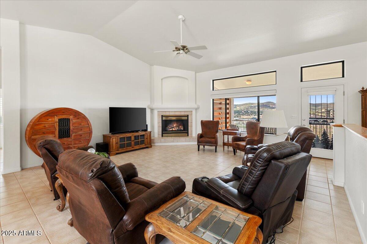 528 Miracle Rider Road Prescott, AZ 86301 - Photo 6 of 47 a living room with furniture a fireplace and a flat screen tv