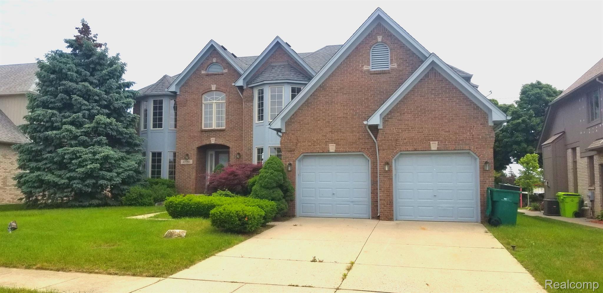 47786 Lighthouse Drive Macomb, MI 48044 - Photo 1 of 32 Front
