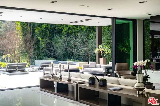 a living room with furniture and garden view