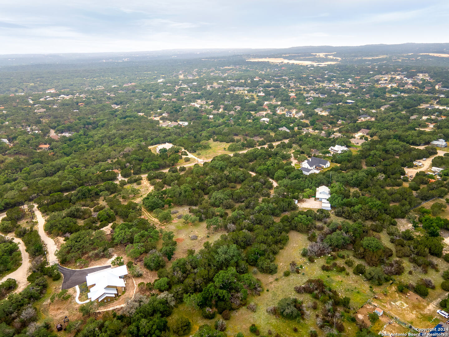 5028 Tanglewood Trail Spring Branch, TX 78070 - Photo 2 of 14 an aerial view of residential houses with city view