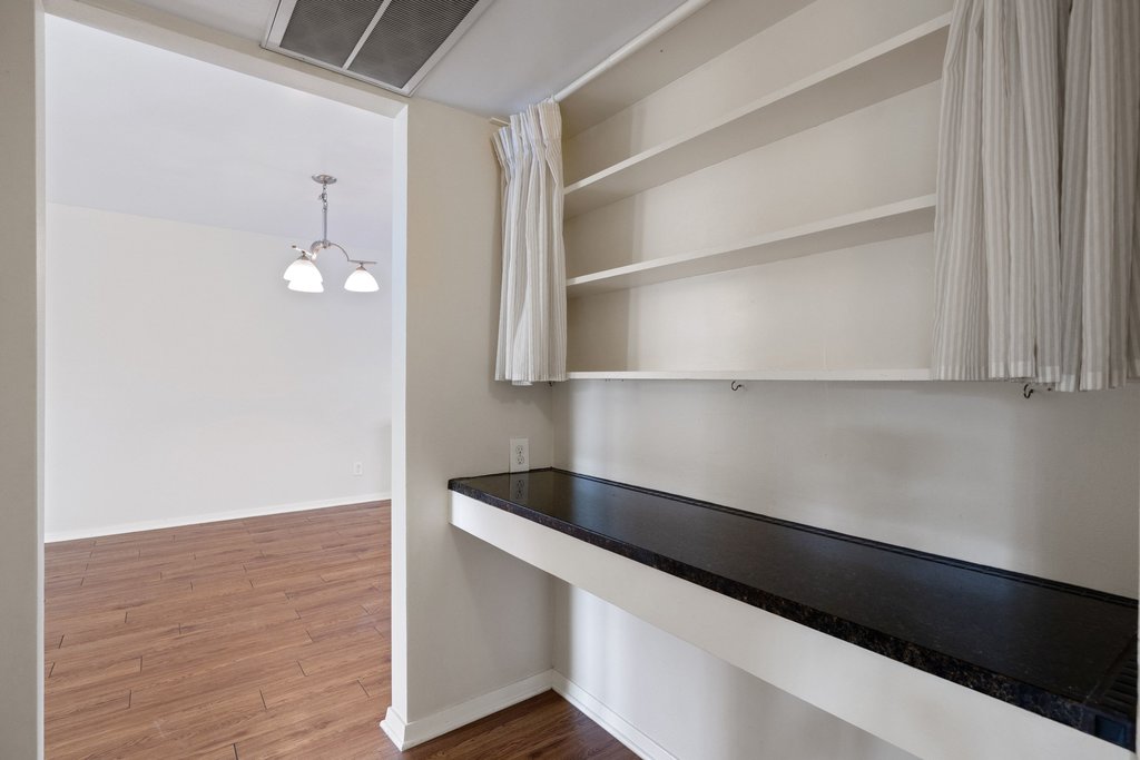 1210 Windsor Road, Unit 209 Austin, TX 78703 - Photo 12 of 38 Tucked within the hallway is the perfect space for remote work or even a drop zone to keep the rest of your home tidy.