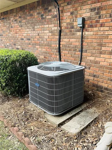 a view of a door with brick walls