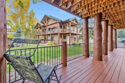 a view of a brick house with iron fence