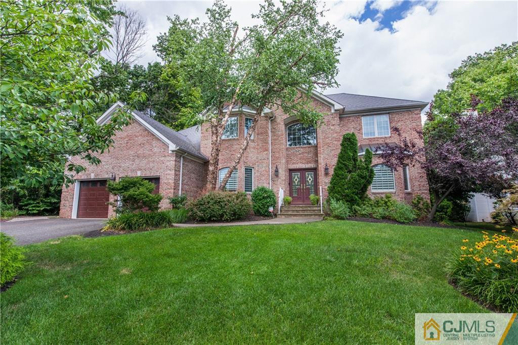 16 Ron's Edge Road Springfield, NJ 07081 - Photo 1 of 25 a front view of a house with a yard and green space