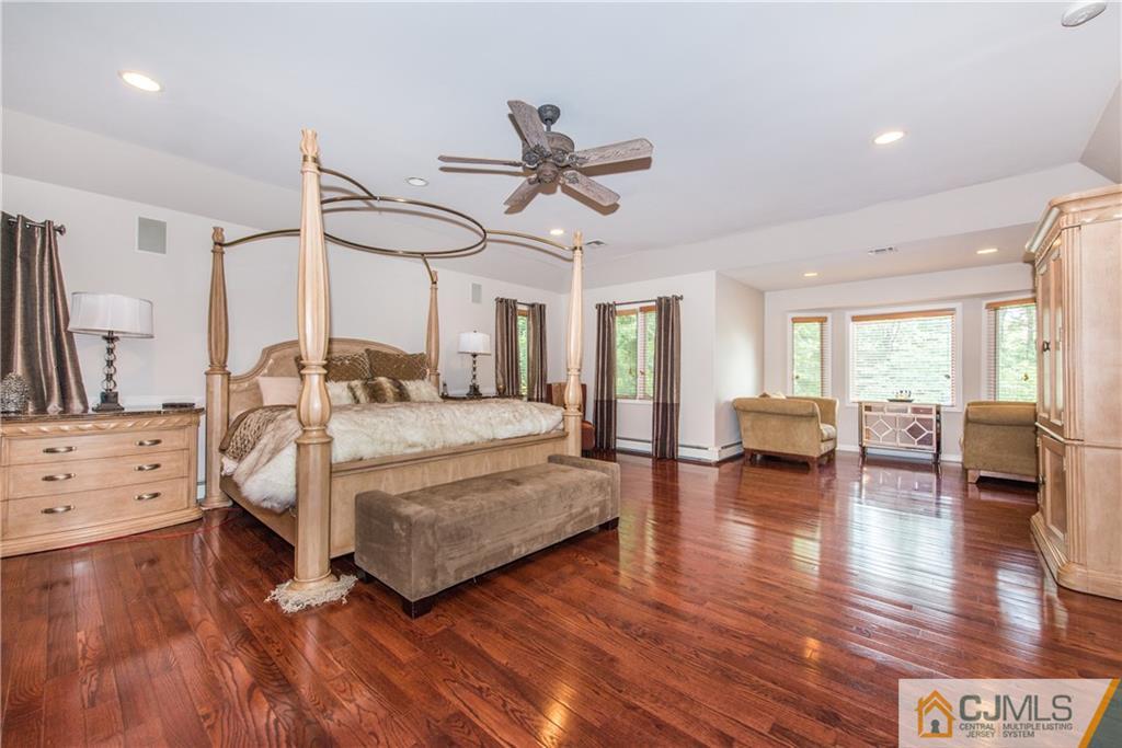 16 Ron's Edge Road Springfield, NJ 07081 - Photo 12 of 25 a bedroom with furniture and wooden floor