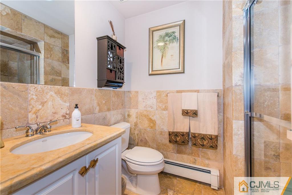 16 Ron's Edge Road Springfield, NJ 07081 - Photo 15 of 25 a bathroom with a sink toilet and shower