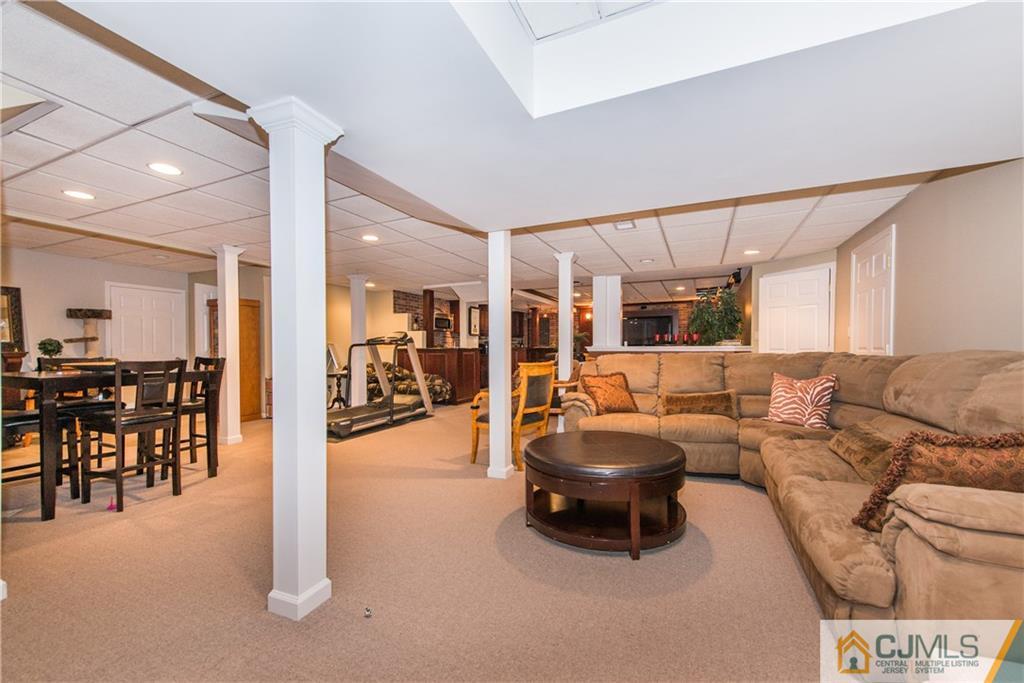 16 Ron's Edge Road Springfield, NJ 07081 - Photo 17 of 25 a living room with furniture and a table
