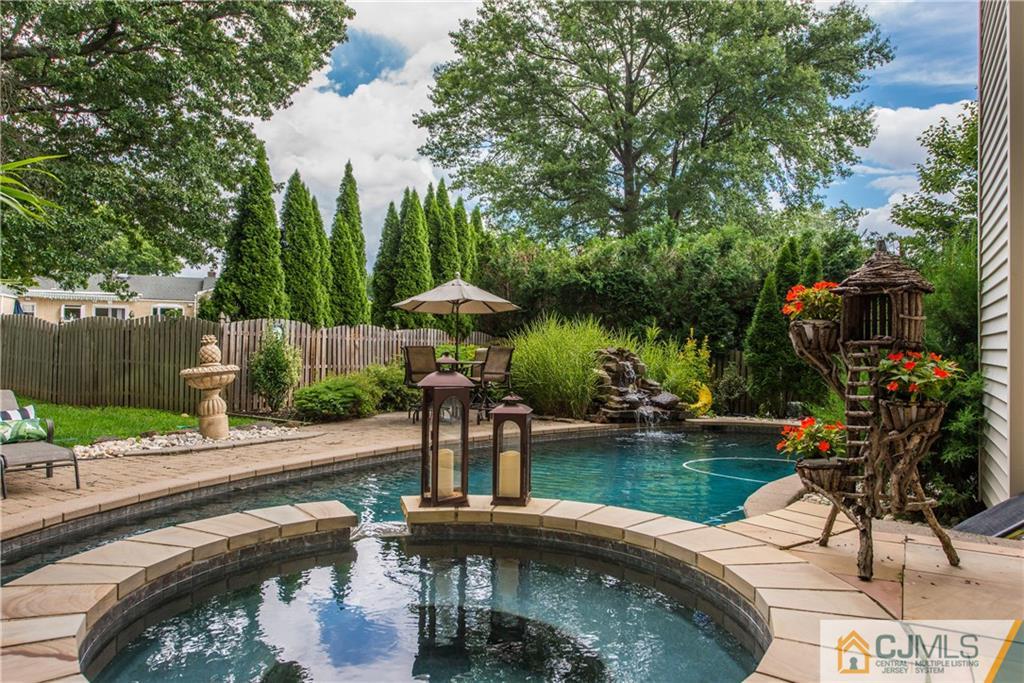 16 Ron's Edge Road Springfield, NJ 07081 - Photo 21 of 25 a swimming pool with outdoor seating and plants