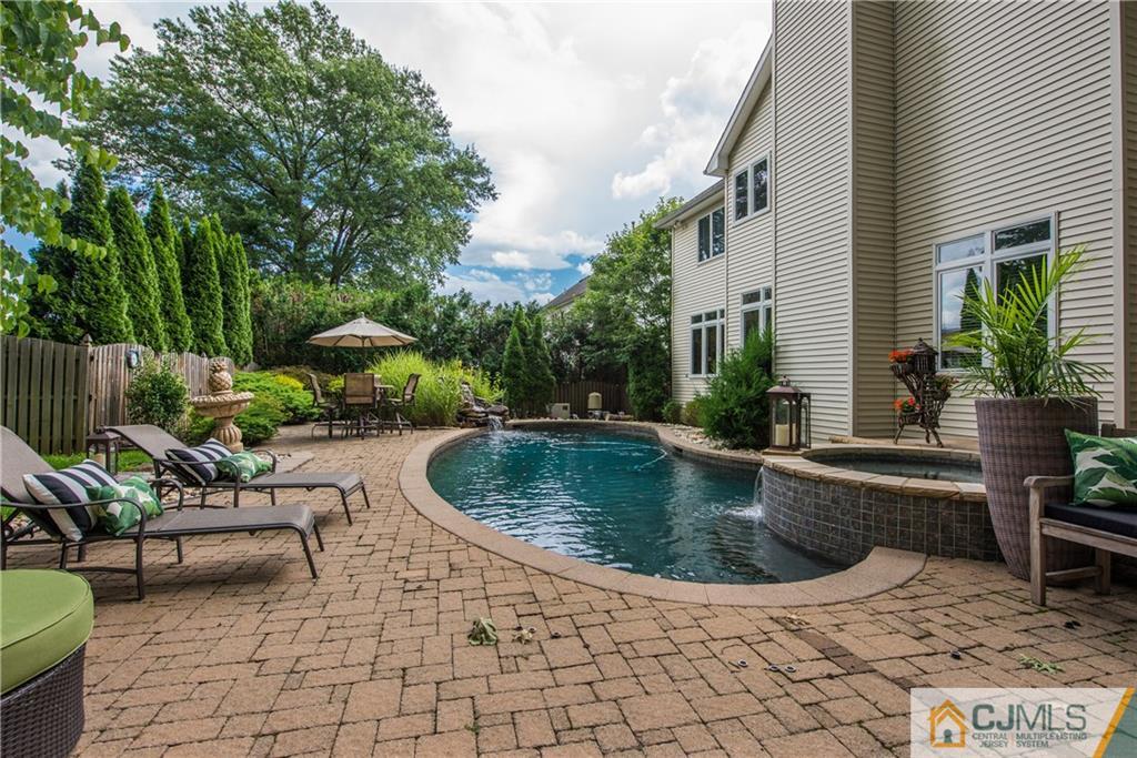 16 Ron's Edge Road Springfield, NJ 07081 - Photo 22 of 25 a view of swimming pool with outdoor seating and plants
