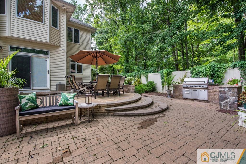 16 Ron's Edge Road Springfield, NJ 07081 - Photo 23 of 25 a view of house with backyard and outdoor seating