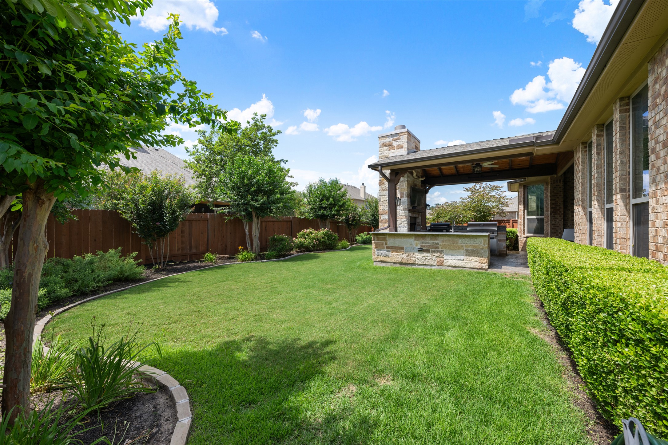 3021 Wedgescale Pass Leander, TX 78641 - Photo 32 of 40 a view of a house with backyard and sitting area