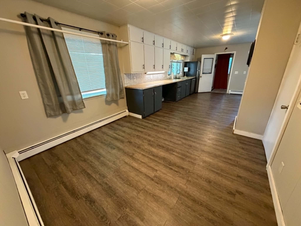 280 State Road North Adams, MA 01247 - Photo 9 of 35 a view of a kitchen with wooden floor and electronic appliances