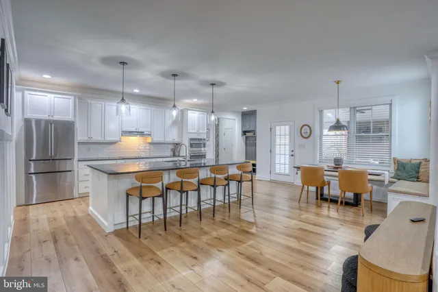 a bedroom with a bed a window and a chandelier
