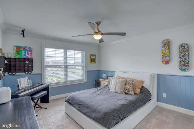 an aerial view of a house with a big yard and large trees