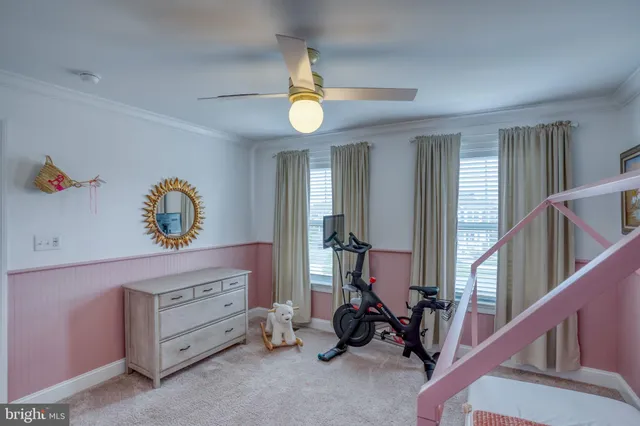 an aerial view of residential houses with outdoor space and river