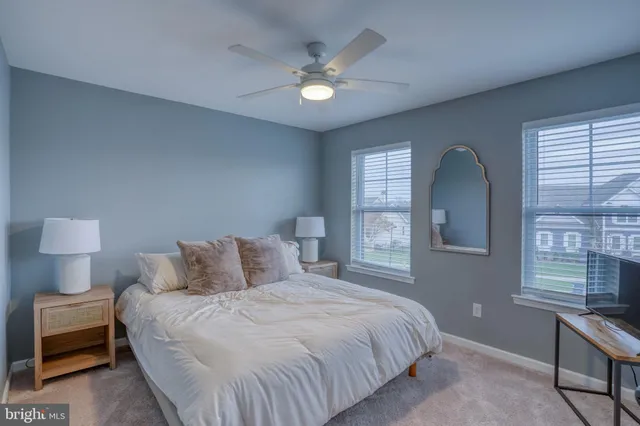a front view of a house with a yard table and chairs