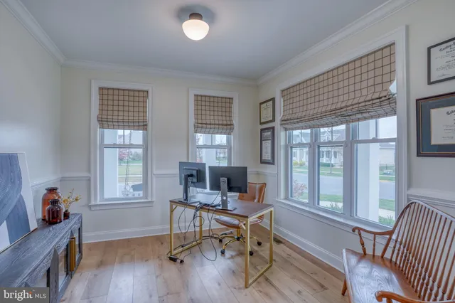 a living room with furniture a window and a fireplace