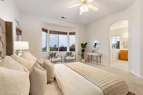 a view of a living room and floor to ceiling window