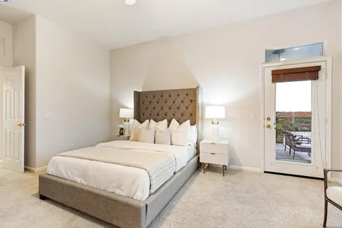 a bathroom with a double vanity sink mirror and bathtub