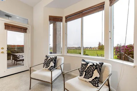 a spacious bathroom with a double vanity sink mirror and bathtub