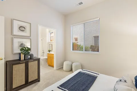 a utility room with cabinets washer and dryer