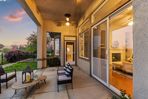 a view of backyard with a garden and deck