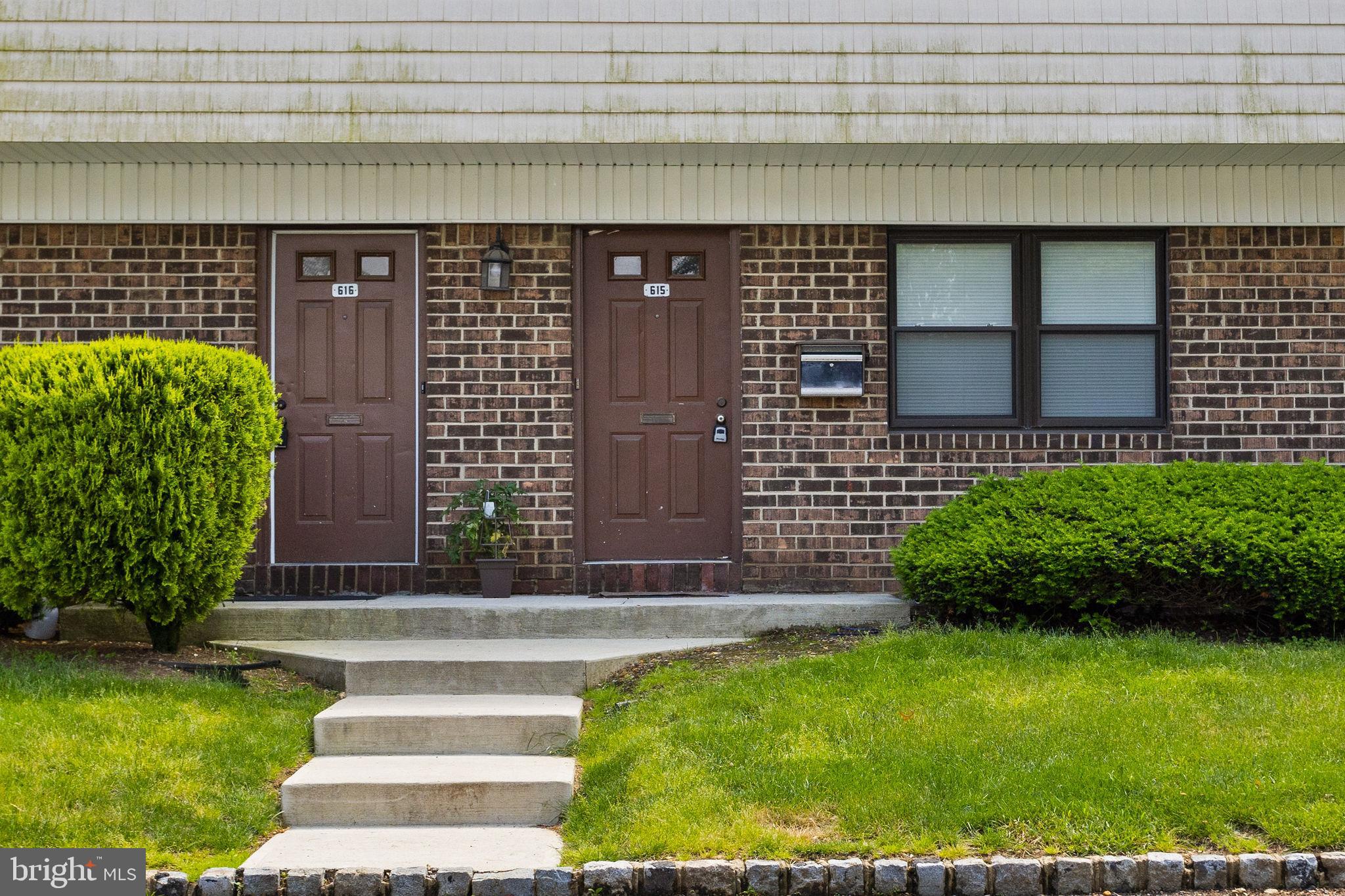 615 Silver Court Hamilton, NJ 08690 - Photo 2 of 22 a front view of a house with garden