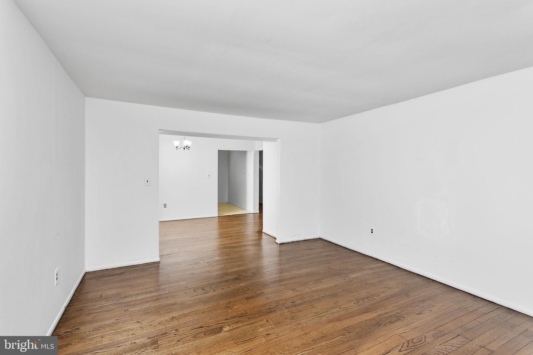615 Silver Court Hamilton, NJ 08690 - Photo 8 of 22 a view of an empty room with wooden floor