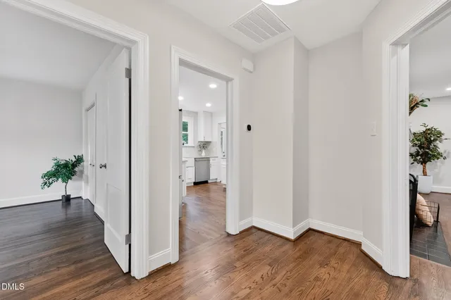 a view of an entryway with wooden floor