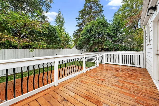 a balcony with wooden floor