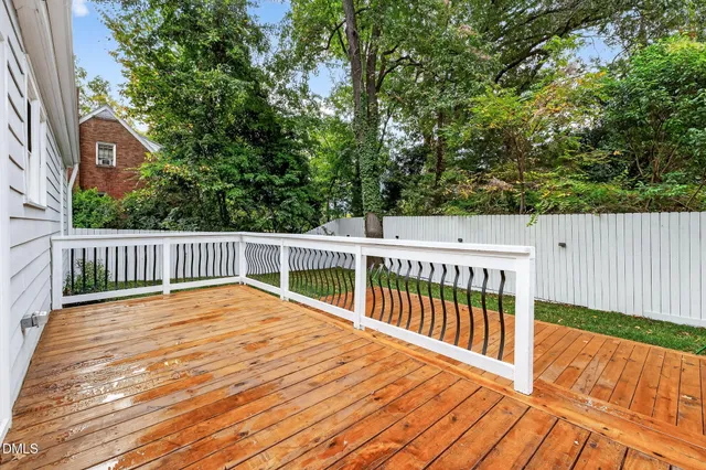 a view of balcony with wooden floor