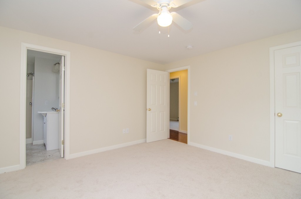 161 Hardwick Road Barre, MA 01005 - Photo 11 of 21 a view of an empty room and a chandelier fan