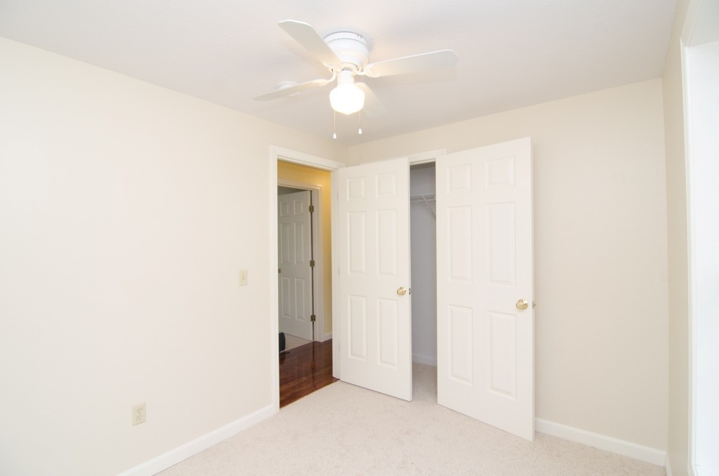 161 Hardwick Road Barre, MA 01005 - Photo 13 of 21 an empty room with a ceiling fan and a window