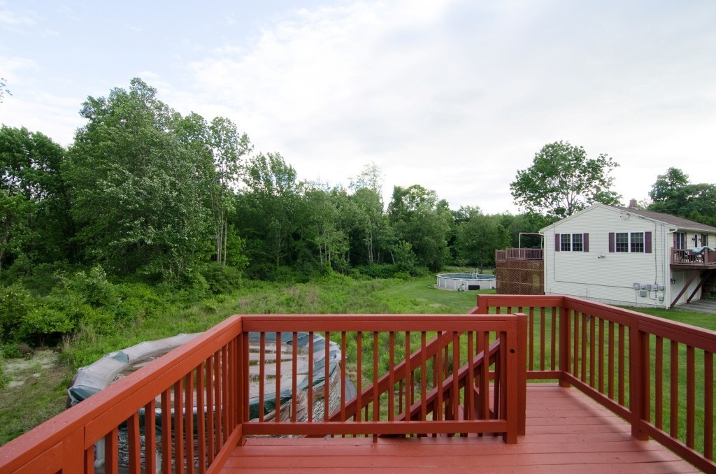 161 Hardwick Road Barre, MA 01005 - Photo 21 of 21 a view of a wooden deck and a yard with swimming pool