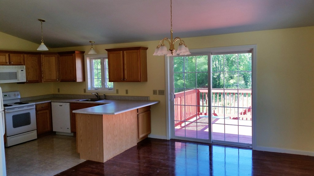 161 Hardwick Road Barre, MA 01005 - Photo 7 of 21 a kitchen with stainless steel appliances granite countertop a stove a sink and a refrigerator
