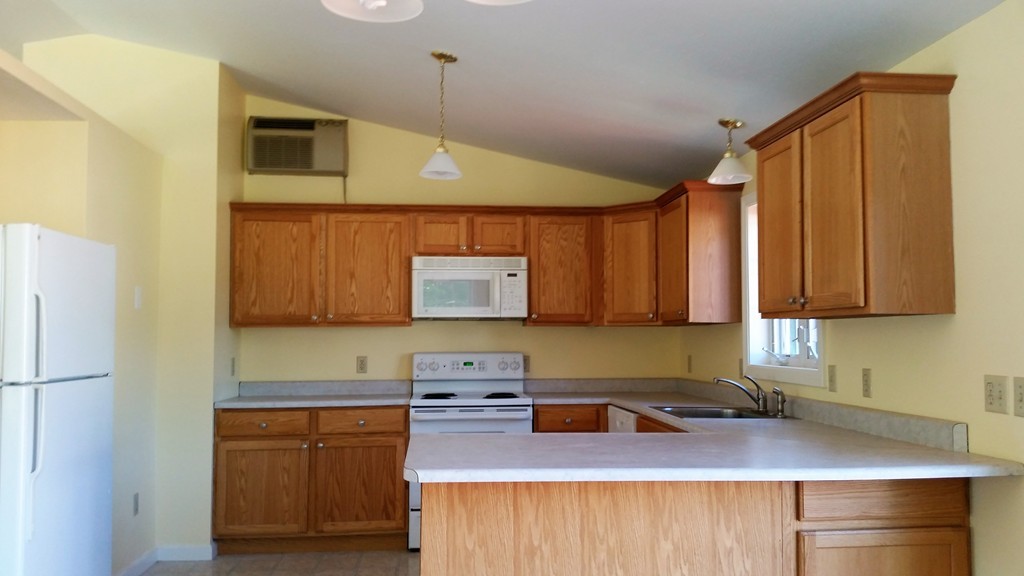161 Hardwick Road Barre, MA 01005 - Photo 8 of 21 a kitchen with stainless steel appliances granite countertop a sink refrigerator and microwave