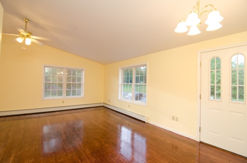 161 Hardwick Road Barre, MA 01005 - Photo 10 of 21 a view of an empty room with a window and wooden floor