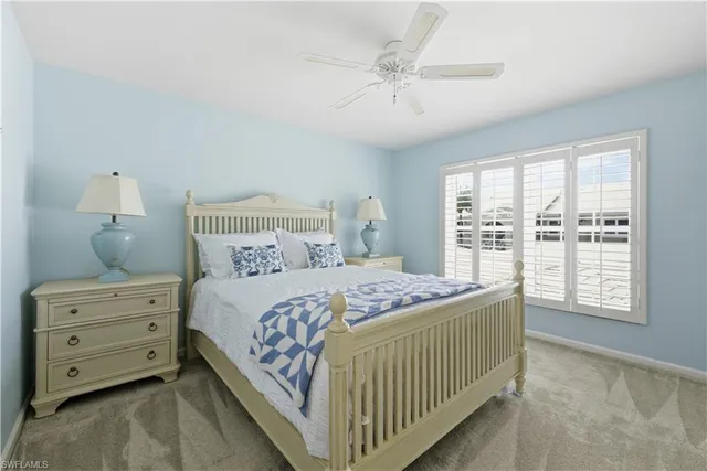 a bedroom with a bed a window and closet