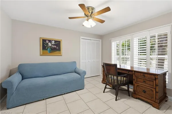 a living room with furniture and a window