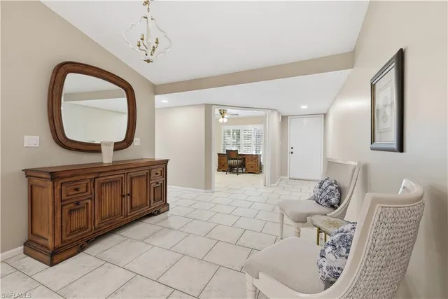a spacious bathroom with a granite countertop sink a mirror and vanity
