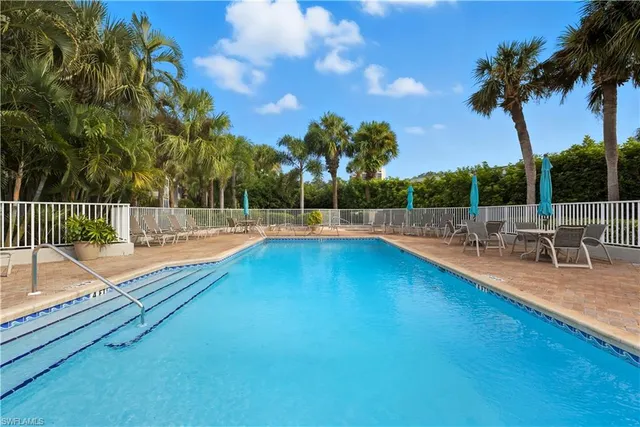 a view of a swimming pool with a lounge chairs